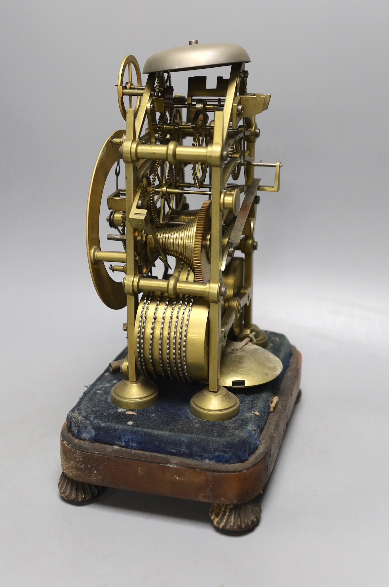 A 19th century brass twin fusee skeleton clock in perspex case with key and pendulum